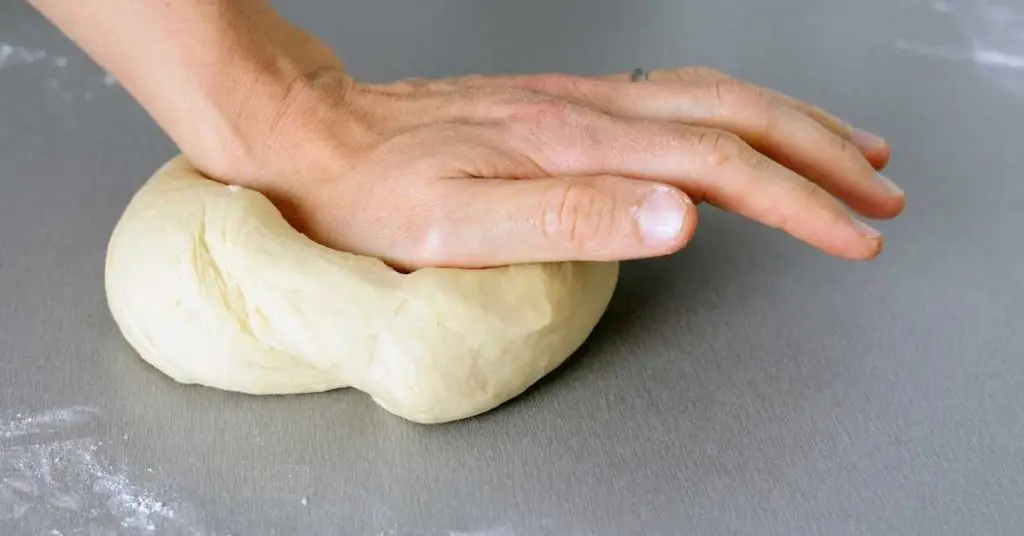 Why Your Pizza Dough Is Too Hard: The Secrets To Soft Pizza Dough 6 pizza dough should look like 4 Why Your Pizza Dough Is Too Hard: The Secrets To Soft Pizza Dough