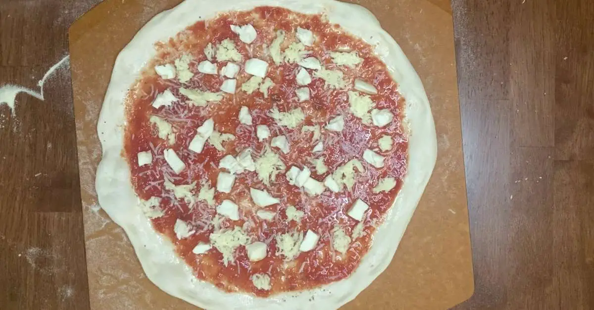 a homemade pizza about to go in the oven