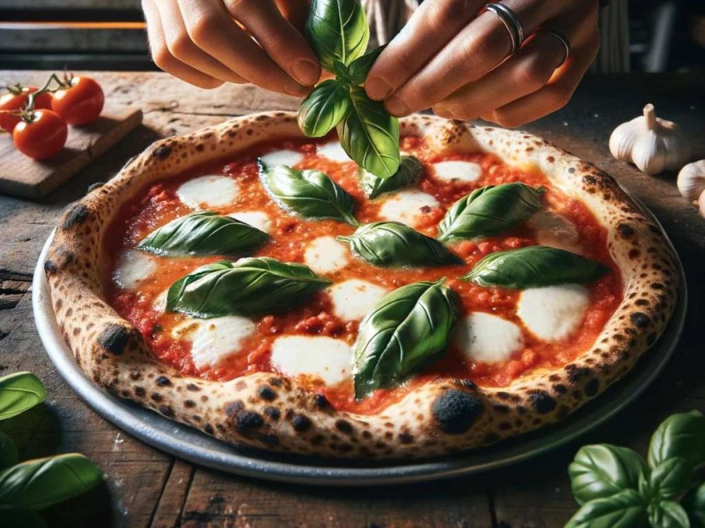 A neapolitan pizza with fresh basil leaves on top.