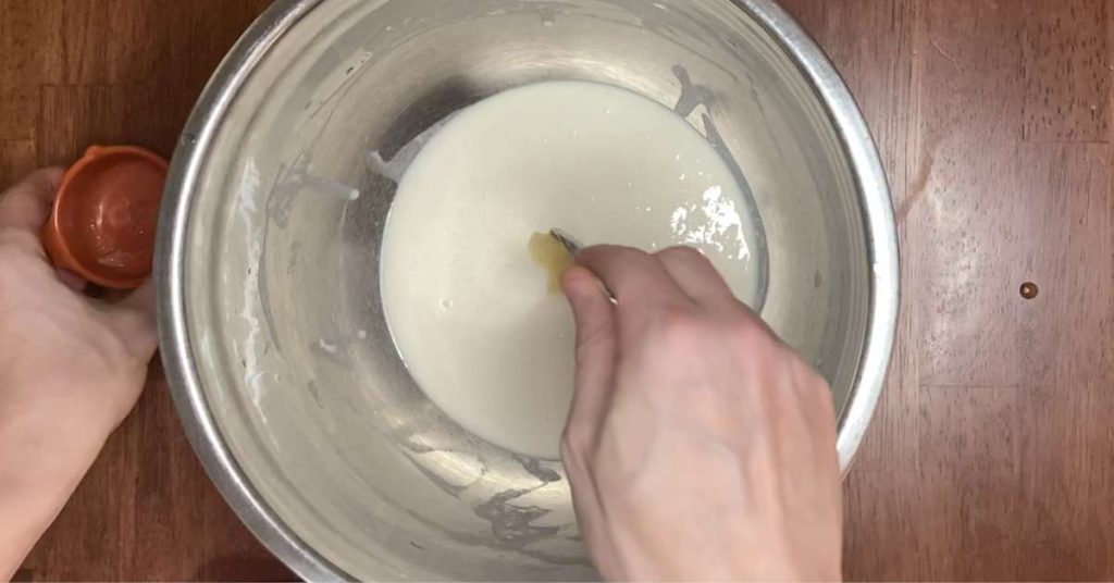 making poolish in a mixing bowl