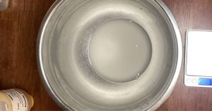 water and yeast in a mixing bowl