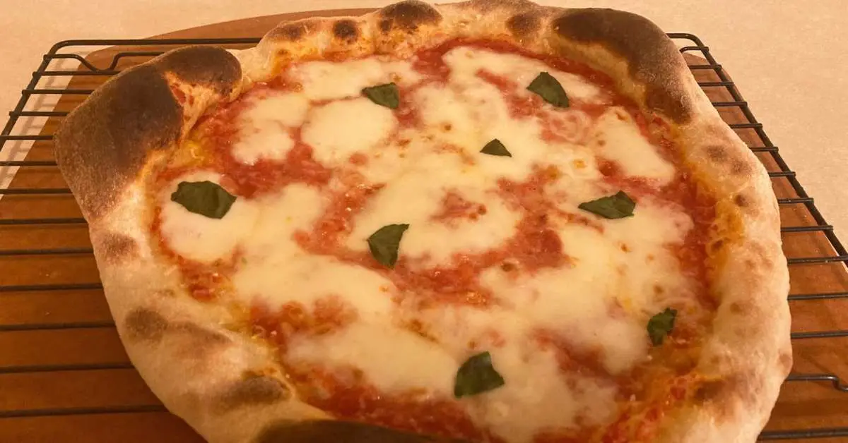 A homemade Neapolitan style pizza made in a home oven using a pizza steel.