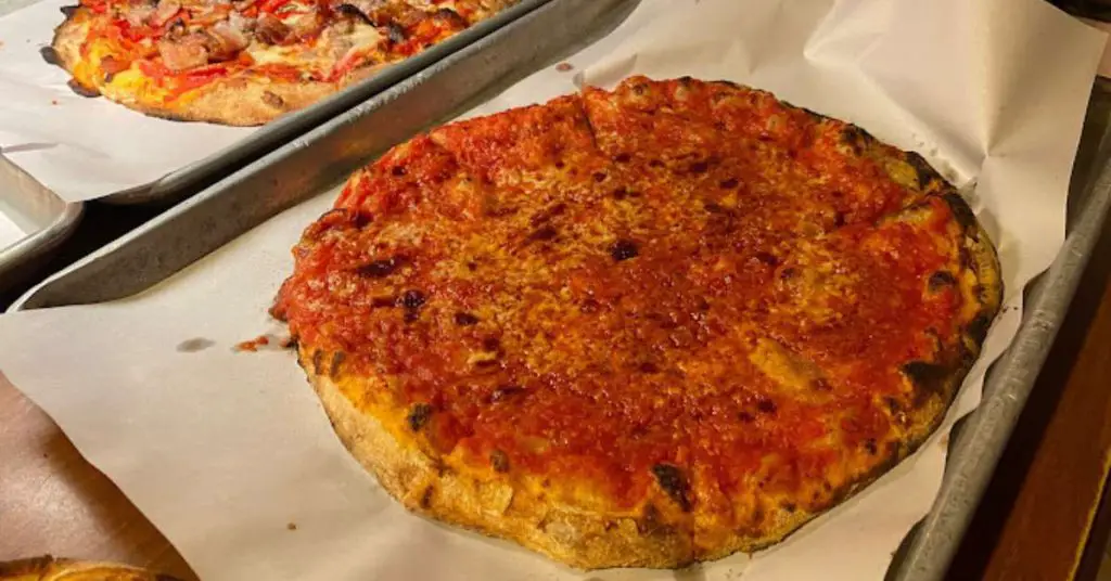 What Is New Haven Style Pizza, And Why Is It Called "Apizza"? 14 New Haven Modern Apizza tray What Is New Haven Style Pizza, And Why Is It Called "Apizza"?