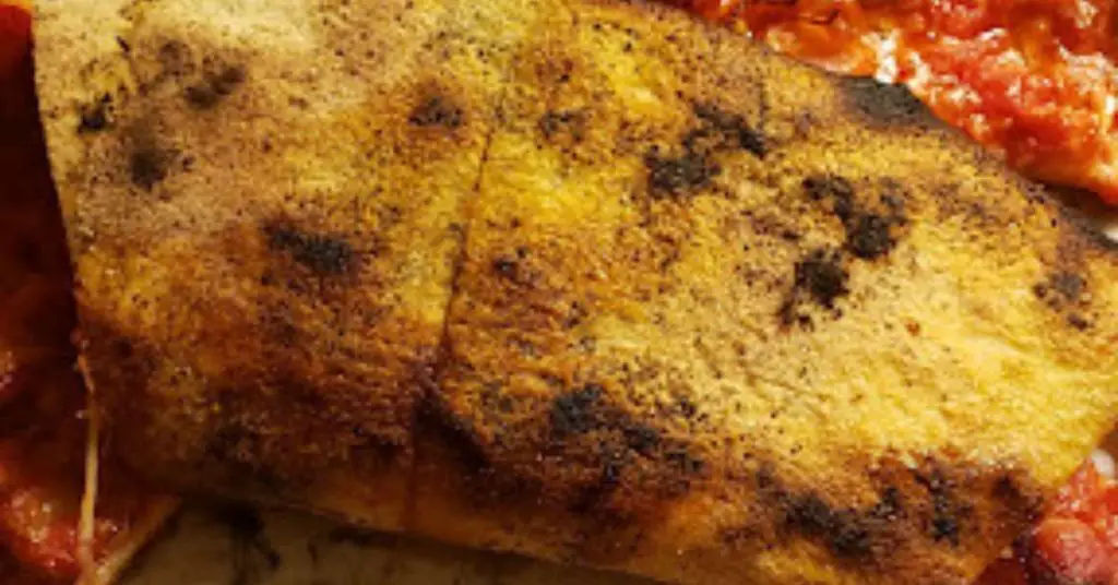 What Is New Haven Style Pizza, And Why Is It Called "Apizza"? 17 new haven crust underside charring What Is New Haven Style Pizza, And Why Is It Called "Apizza"?