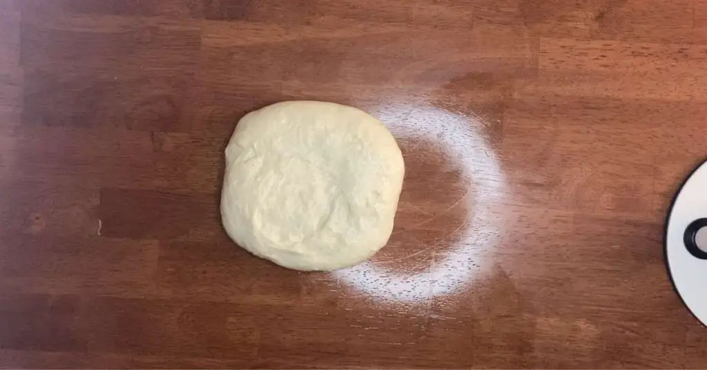 What pizza dough looks like before being shaped into a ball for proofing