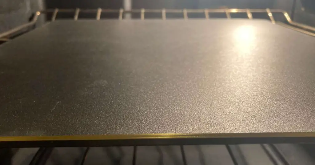 How To Fix Soggy Pizza Crust: Why Your Pizza is Soggy In The Middle 3 Ooni Pizza Steel 13 sitting on an oven rack
