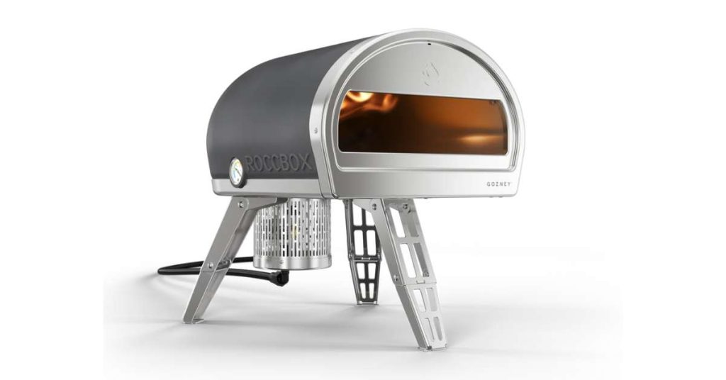 A front facing view of a silver colored Gozney Roccbox pizza oven.