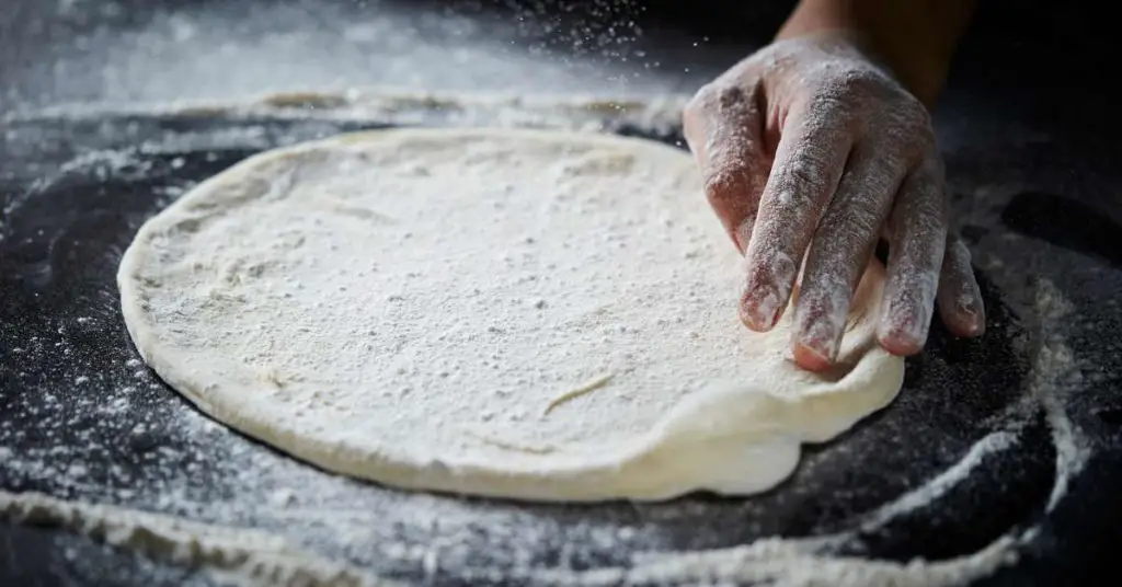 Top 10 Biggest Pizza Dough-Making Mistakes 1 stretched dough ball smooth Top 10 Biggest Pizza Dough-Making Mistakes