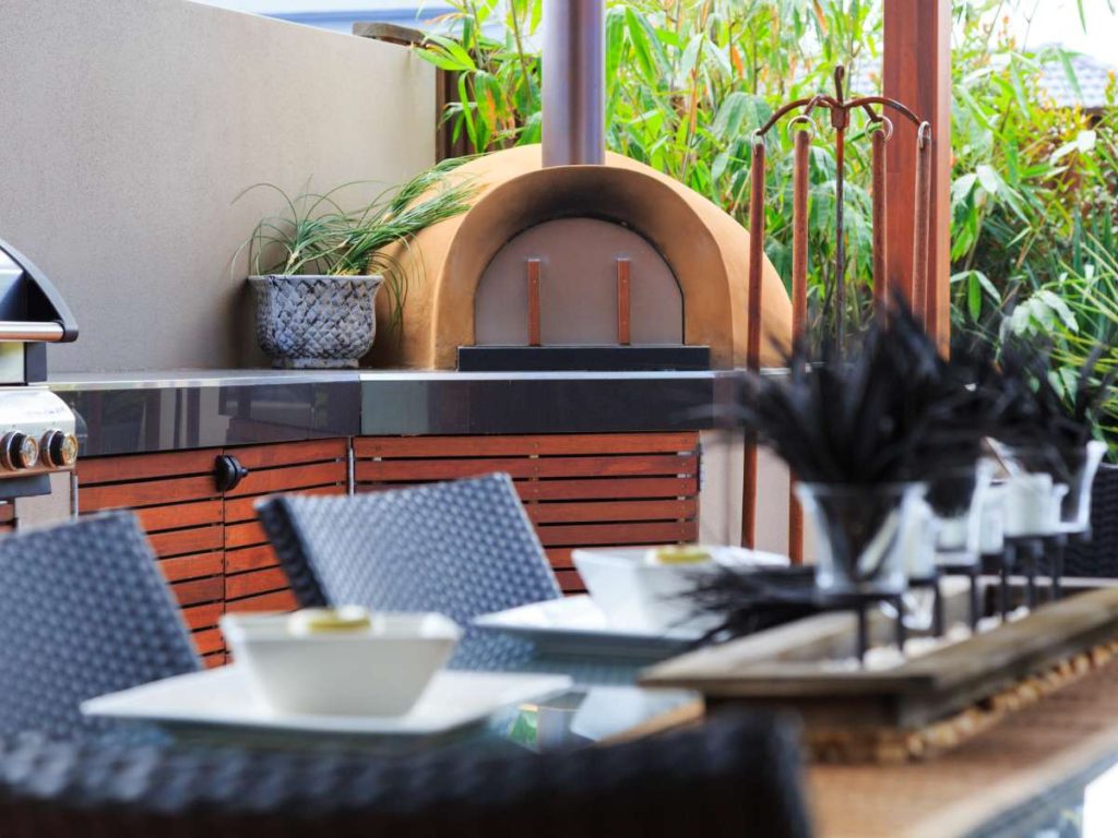 A pizza oven on a patio.