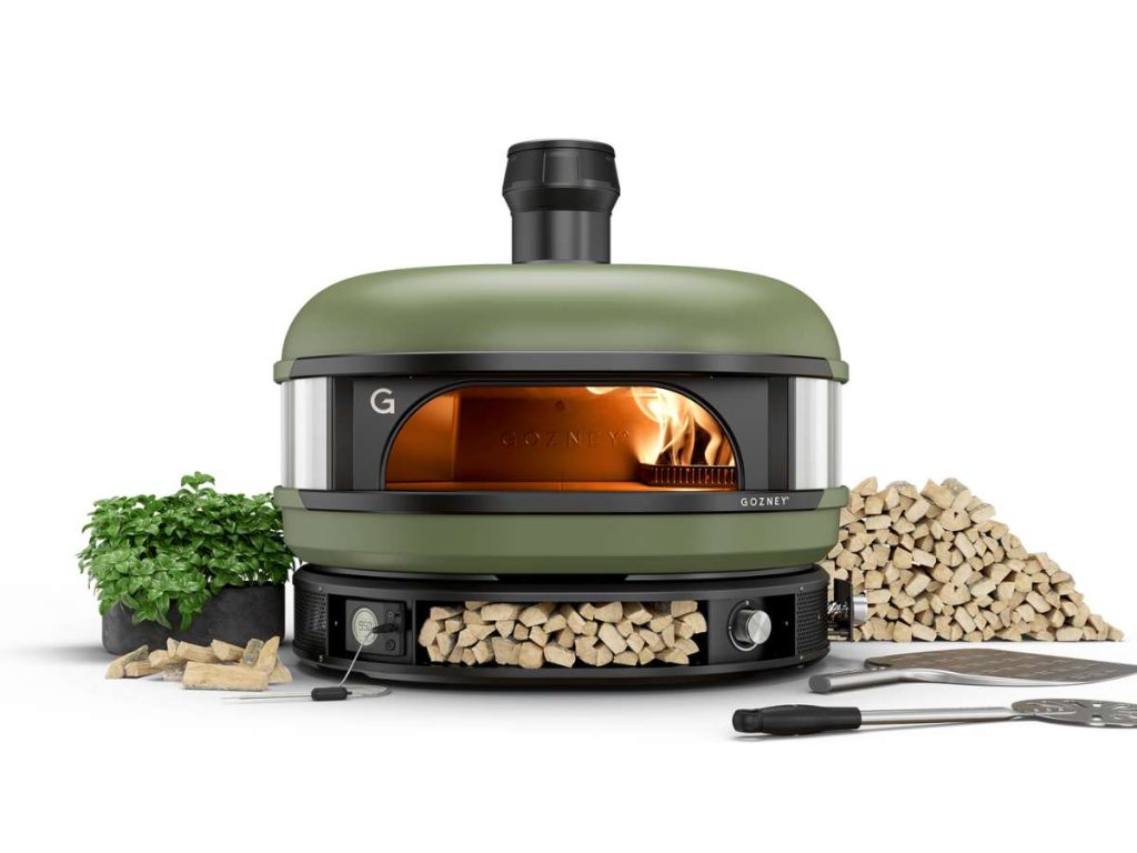 A green Gozney Dome pizza oven on a plain white background.