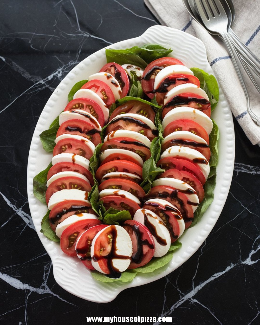 Fresh and Easy Caprese Salad Recipe for a Healthy Italian Delight 1 A beautifully arranged Caprese salad on a white platter features alternating slices of ripe tomatoes and fresh mozzarella, garnished with basil leaves and drizzled with balsamic glaze.
